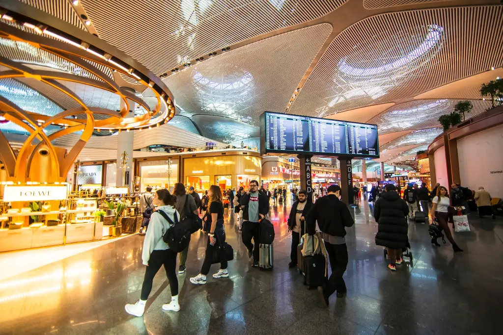 Bright modern interior of an Istanbul airport terminal with passengers